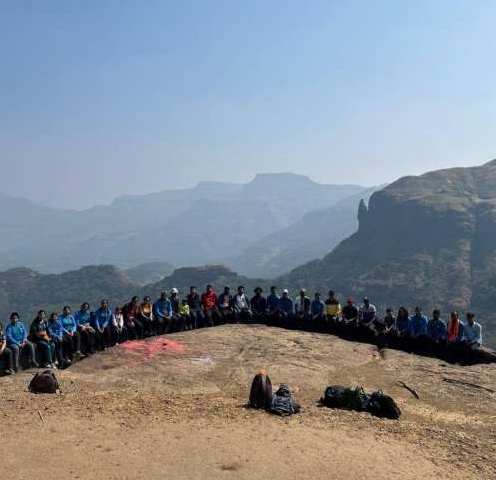 A trekking group lined up on a Sahyadri ridge