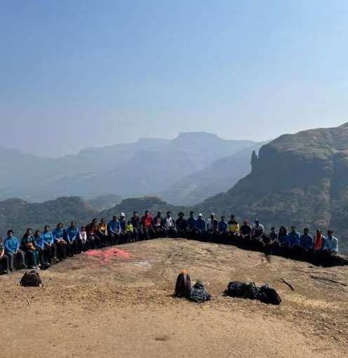 A trekking group lined up on a Sahyadri ridge
